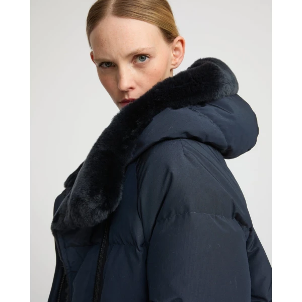 Woman wearing Yves Salomon shearling fur coat – luxury outerwear at Coveti