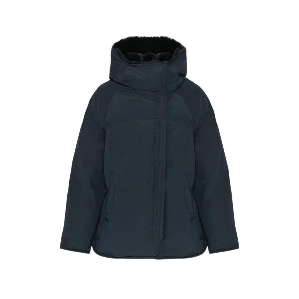 Woman wearing Yves Salomon shearling fur coat – luxury outerwear at Coveti