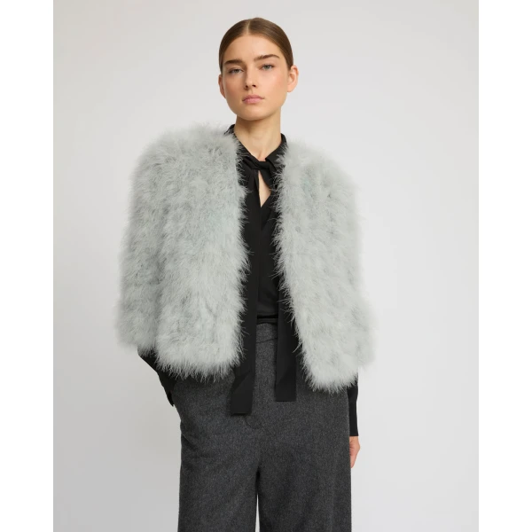 Woman wearing Yves Salomon shearling fur coat – luxury outerwear at Coveti