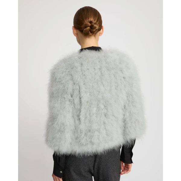 Woman wearing Yves Salomon shearling fur coat – luxury outerwear at Coveti