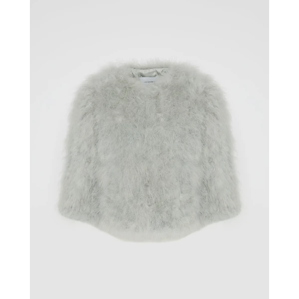 Woman wearing Yves Salomon shearling fur coat – luxury outerwear at Coveti