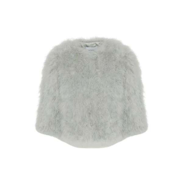 Woman wearing Yves Salomon shearling fur coat – luxury outerwear at Coveti
