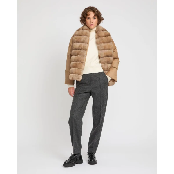 Woman wearing Yves Salomon shearling fur coat – luxury outerwear at Coveti
