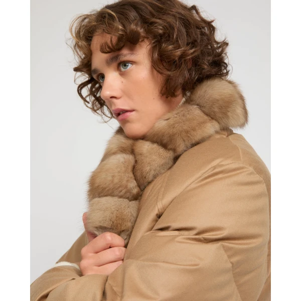 Woman wearing Yves Salomon shearling fur coat – luxury outerwear at Coveti