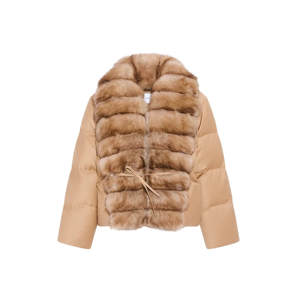 Woman wearing Yves Salomon shearling fur coat – luxury outerwear at Coveti
