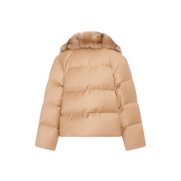 Woman wearing Yves Salomon shearling fur coat – luxury outerwear at Coveti