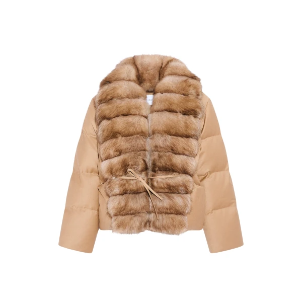 Woman wearing Yves Salomon shearling fur coat – luxury outerwear at Coveti