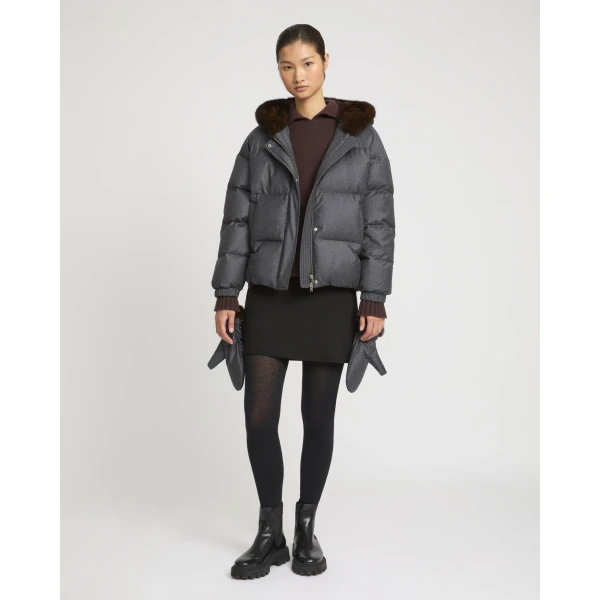 Woman wearing Yves Salomon shearling fur coat – luxury outerwear at Coveti