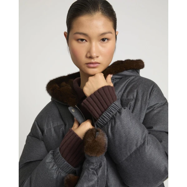 Woman wearing Yves Salomon shearling fur coat – luxury outerwear at Coveti