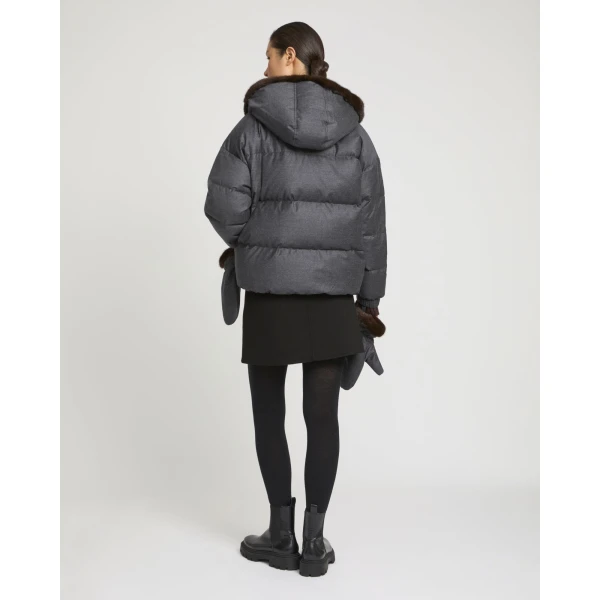Woman wearing Yves Salomon shearling fur coat – luxury outerwear at Coveti