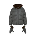 Woman wearing Yves Salomon shearling fur coat – luxury outerwear at Coveti