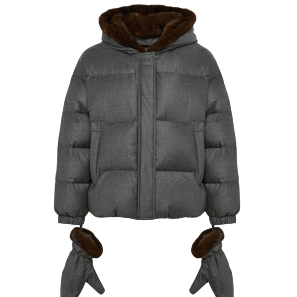 Woman wearing Yves Salomon shearling fur coat – luxury outerwear at Coveti