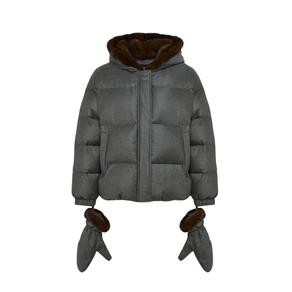 Woman wearing Yves Salomon shearling fur coat – luxury outerwear at Coveti