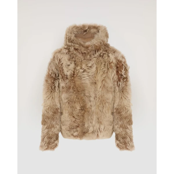 Woman wearing Yves Salomon shearling fur coat – luxury outerwear at Coveti