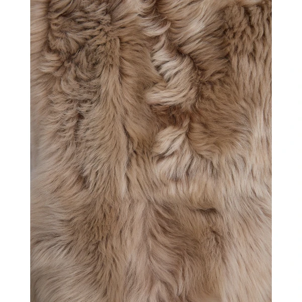 Woman wearing Yves Salomon shearling fur coat – luxury outerwear at Coveti