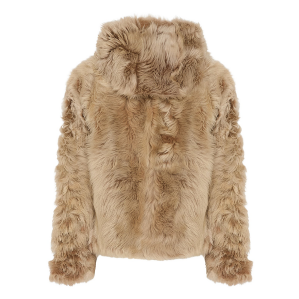 Woman wearing Yves Salomon shearling fur coat – luxury outerwear at Coveti