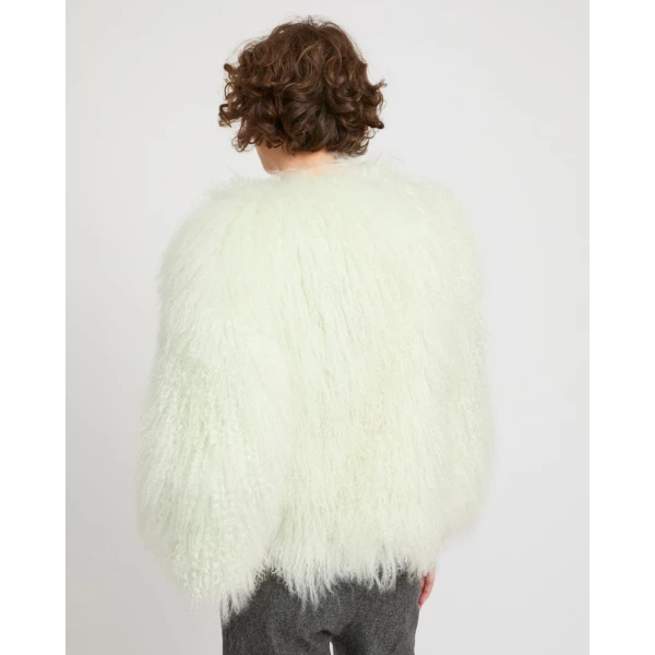 Woman wearing Yves Salomon shearling fur coat – luxury outerwear at Coveti