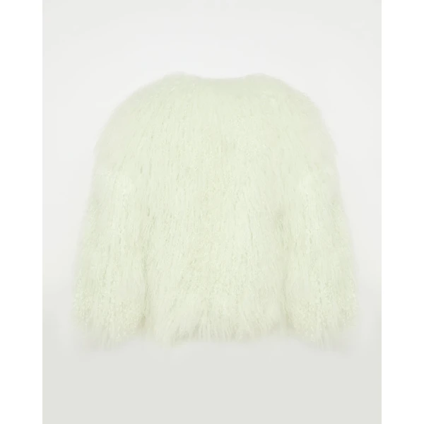 Woman wearing Yves Salomon shearling fur coat – luxury outerwear at Coveti