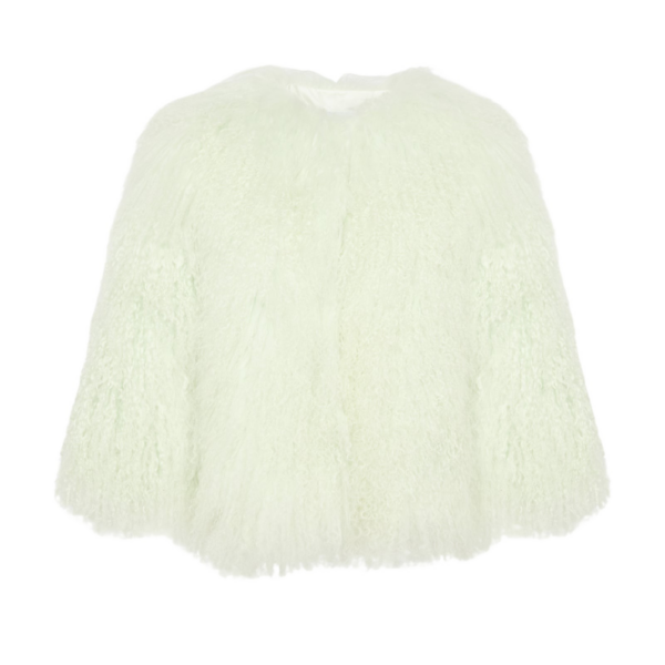 Woman wearing Yves Salomon shearling fur coat – luxury outerwear at Coveti