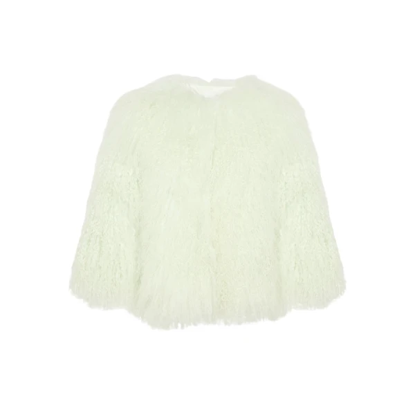 Woman wearing Yves Salomon shearling fur coat – luxury outerwear at Coveti