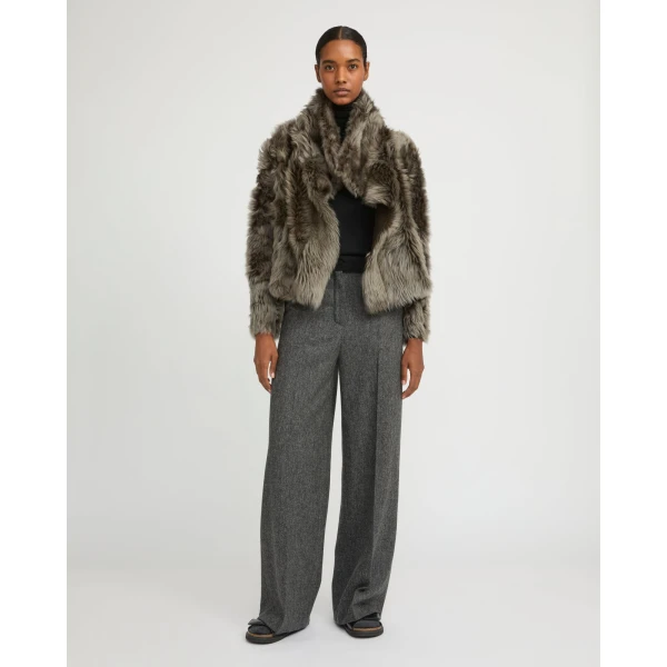 Woman wearing Yves Salomon shearling fur coat – luxury outerwear at Coveti