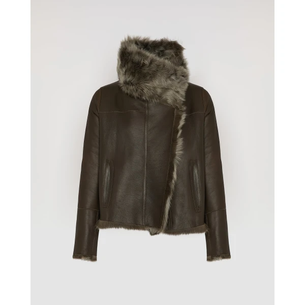 Woman wearing Yves Salomon shearling fur coat – luxury outerwear at Coveti