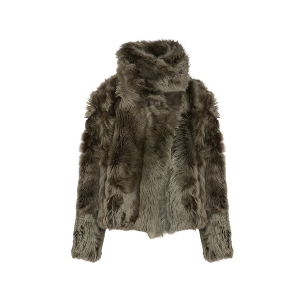 Woman wearing Yves Salomon shearling fur coat – luxury outerwear at Coveti
