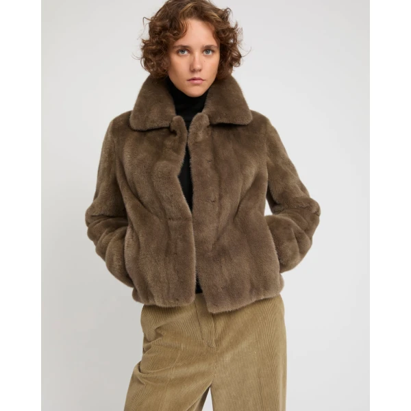 Woman wearing Yves Salomon shearling fur coat – luxury outerwear at Coveti