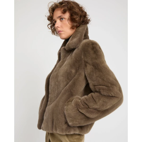 Woman wearing Yves Salomon shearling fur coat – luxury outerwear at Coveti