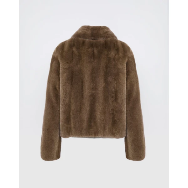 Woman wearing Yves Salomon shearling fur coat – luxury outerwear at Coveti