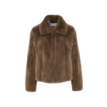 Woman wearing Yves Salomon shearling fur coat – luxury outerwear at Coveti