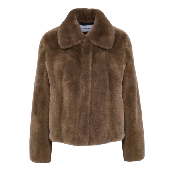 Woman wearing Yves Salomon shearling fur coat – luxury outerwear at Coveti