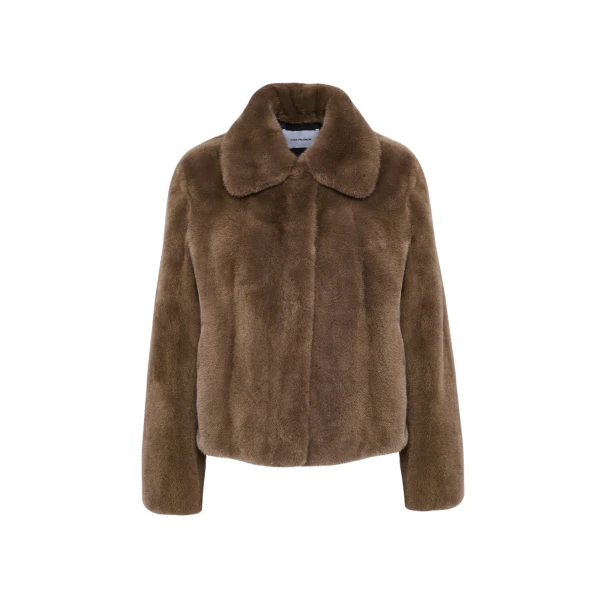 Woman wearing Yves Salomon shearling fur coat – luxury outerwear at Coveti