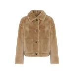Woman wearing Yves Salomon shearling fur coat – luxury outerwear at Coveti