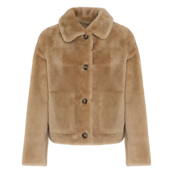 Woman wearing Yves Salomon shearling fur coat – luxury outerwear at Coveti