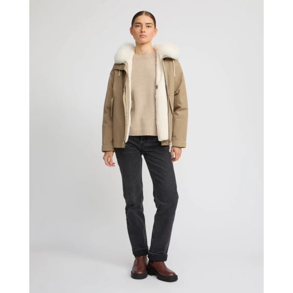 Woman wearing Yves Salomon shearling fur coat – luxury outerwear at Coveti