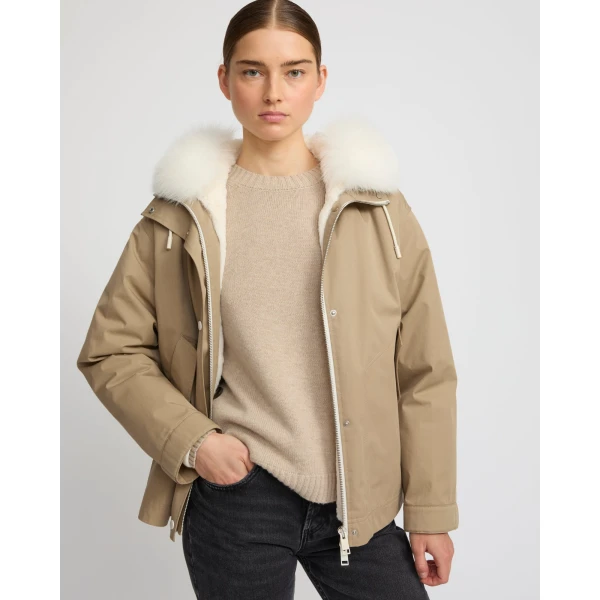 Woman wearing Yves Salomon shearling fur coat – luxury outerwear at Coveti
