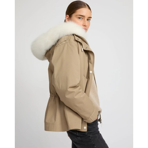 Woman wearing Yves Salomon shearling fur coat – luxury outerwear at Coveti