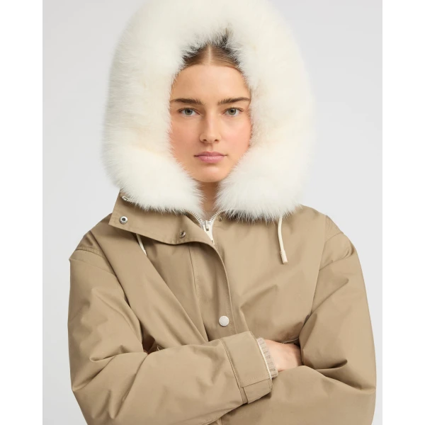 Woman wearing Yves Salomon shearling fur coat – luxury outerwear at Coveti
