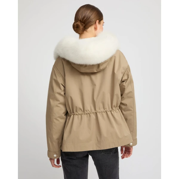 Woman wearing Yves Salomon shearling fur coat – luxury outerwear at Coveti