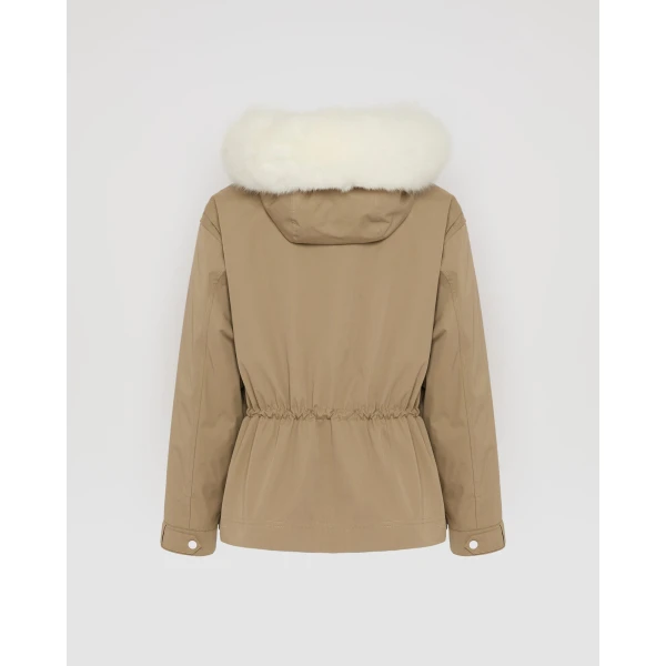 Woman wearing Yves Salomon shearling fur coat – luxury outerwear at Coveti