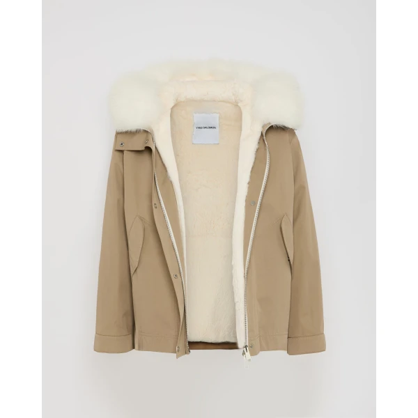 Woman wearing Yves Salomon shearling fur coat – luxury outerwear at Coveti