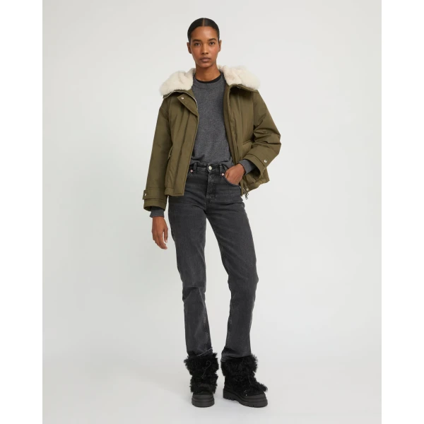 Woman wearing Yves Salomon shearling fur coat – luxury outerwear at Coveti