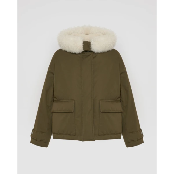 Woman wearing Yves Salomon shearling fur coat – luxury outerwear at Coveti
