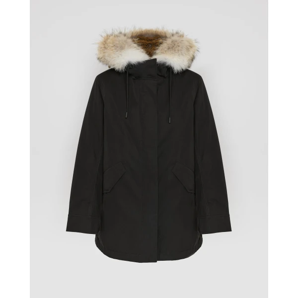 Woman wearing Yves Salomon shearling fur coat – luxury outerwear at Coveti