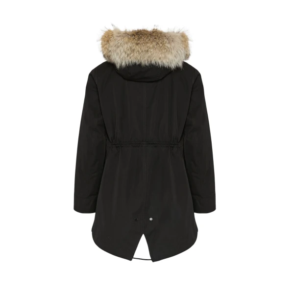 Woman wearing Yves Salomon shearling fur coat – luxury outerwear at Coveti