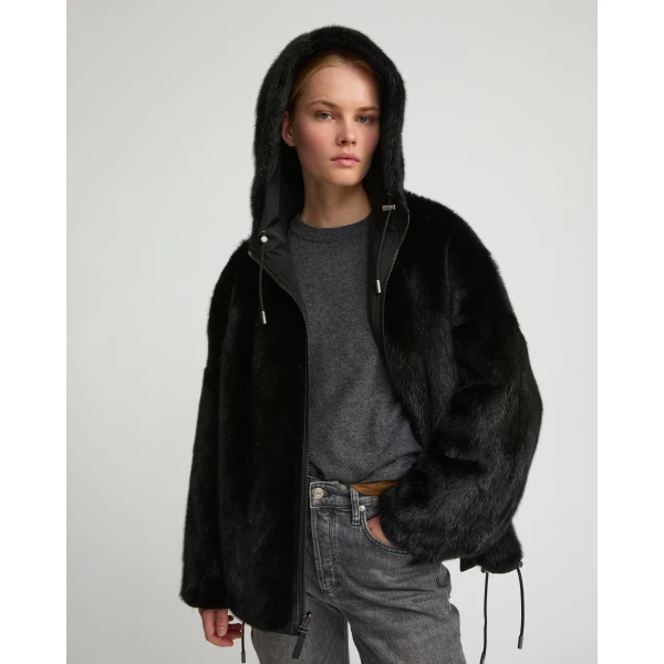 Woman wearing Yves Salomon shearling fur coat – luxury outerwear at Coveti