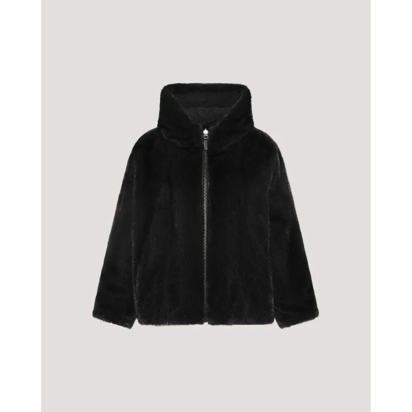 Woman wearing Yves Salomon shearling fur coat – luxury outerwear at Coveti