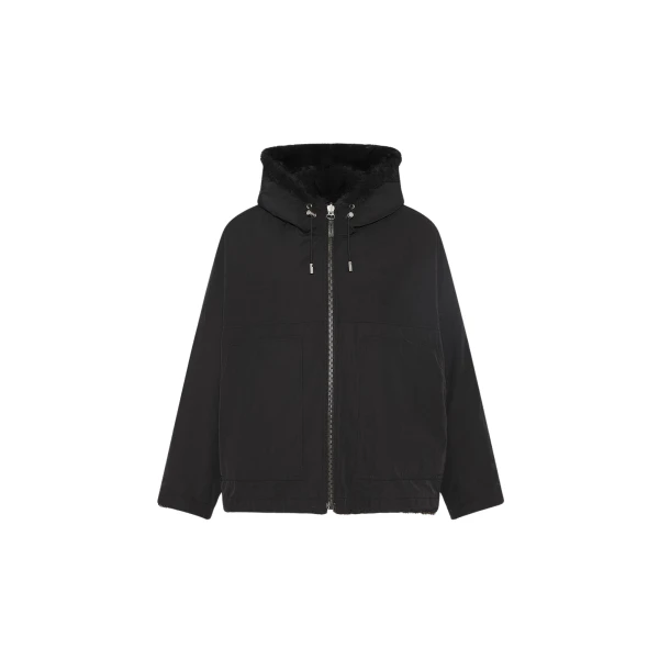 Woman wearing Yves Salomon shearling fur coat – luxury outerwear at Coveti