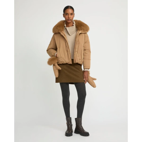 Woman wearing Yves Salomon shearling fur coat – luxury outerwear at Coveti